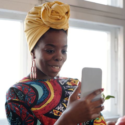 A woman at home on a video call on her phone